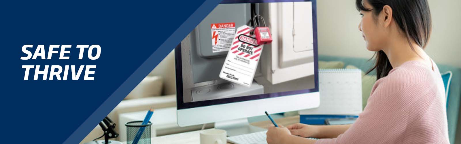 An office staff being online trained the process of lockout tagout as part of the online workplace safety training. The trainee is taking notes on how to securely carry out lockout tagout procedures.