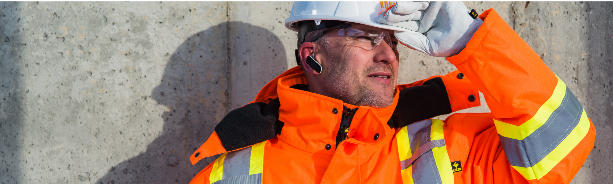 Men working on a construction site with kosto gear